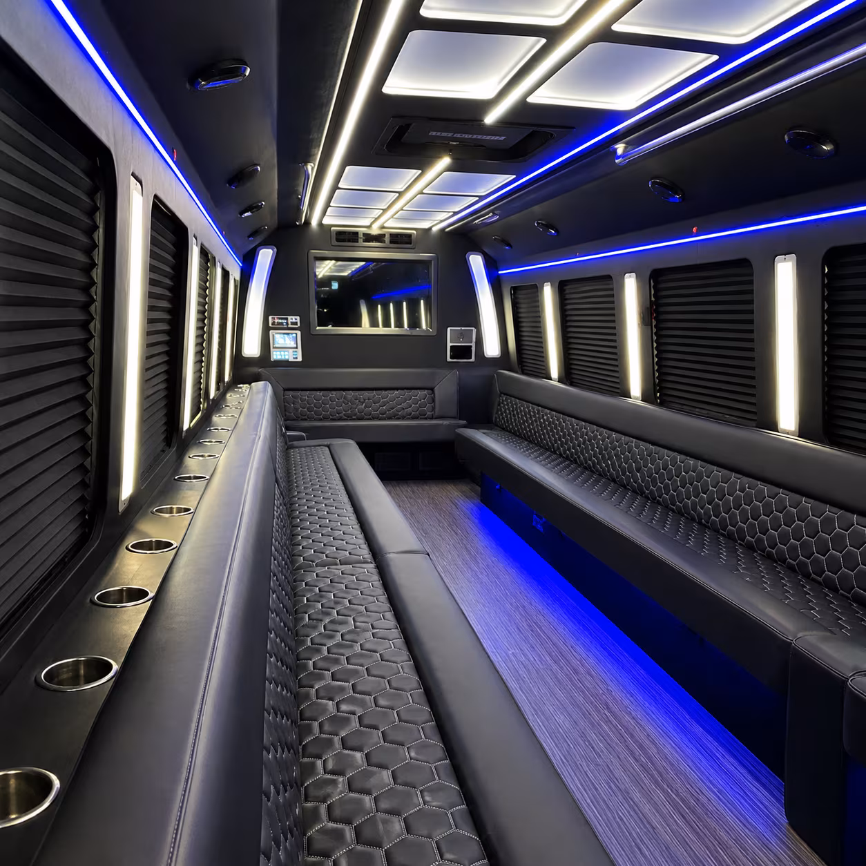 Friends laughing during a party bus celebration in West Palm Beach