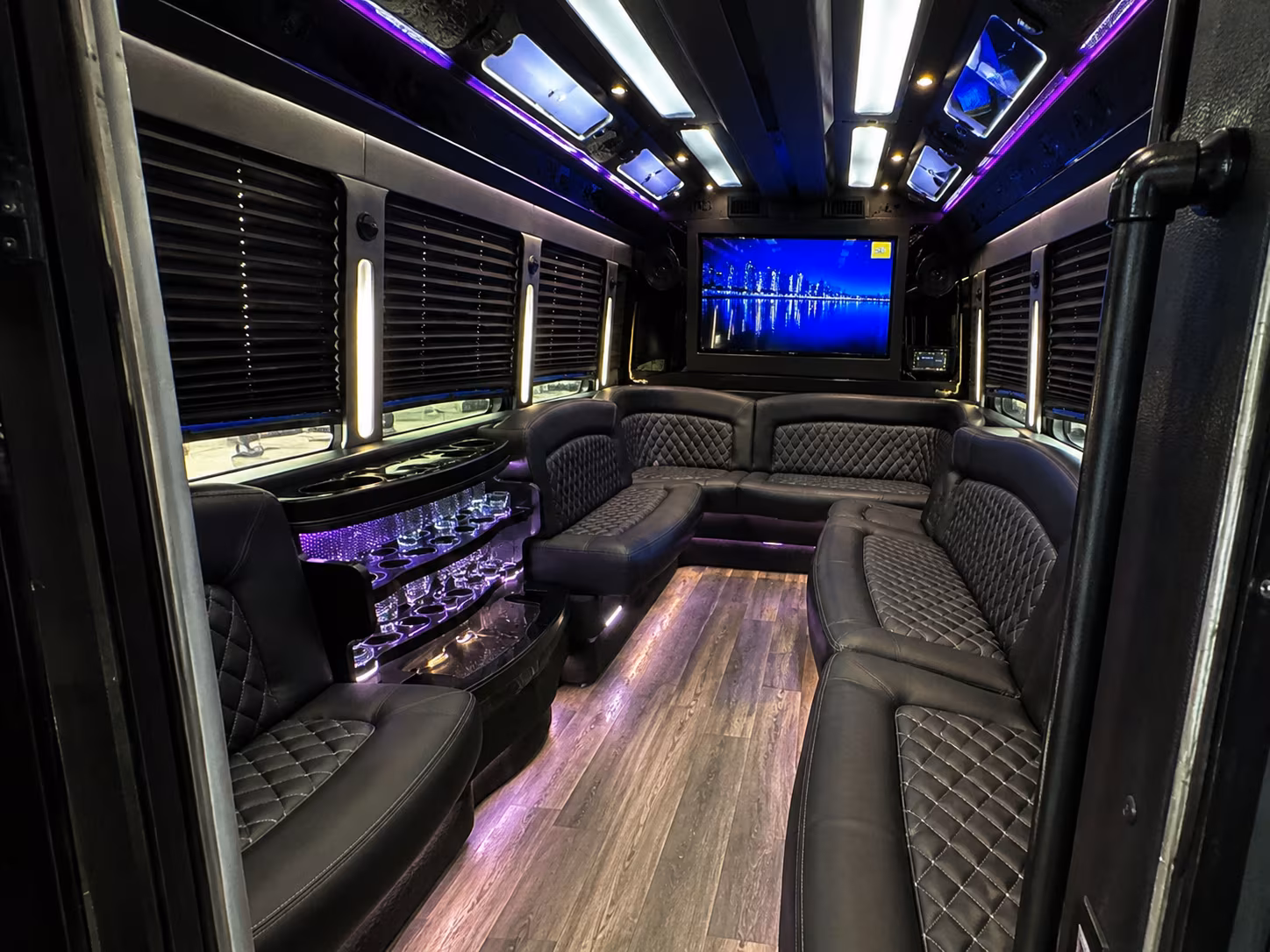 Wedding guests seated inside a party bus serving West Palm Beach